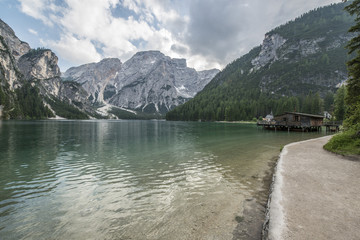 Obraz premium Mountains Panorama of the Dolomites at Alpine lake Braies