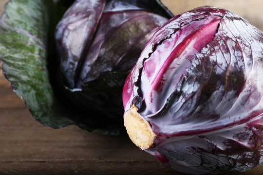 Red cabbage on wooden table, close-up