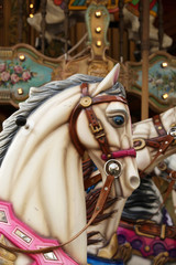Fototapeta na wymiar White horse in Carousel