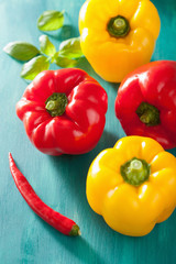 healthy vegetable red yellow peppers on turquoise background