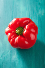 healthy vegetable red pepper on turquoise background