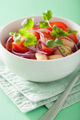 healthy tomato salad with white beans onion cilantro