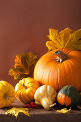 decorative pumpkins and autumn leaves for halloween