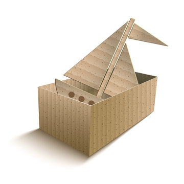 Toy Boat In An Open Cardboard Box