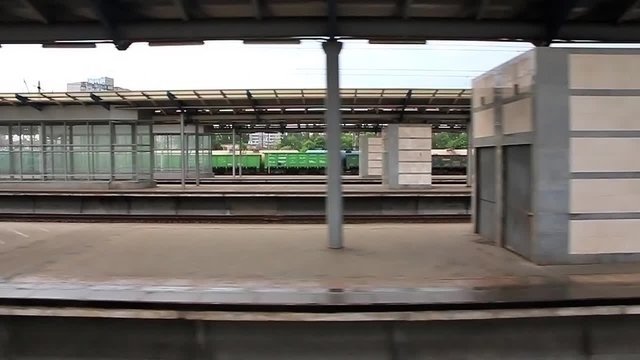 Video filming of railway platform without people from moving train