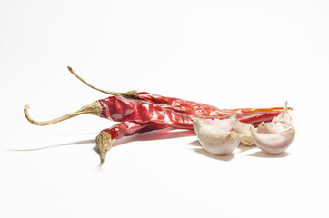 Chili peppers and pieces of garlic