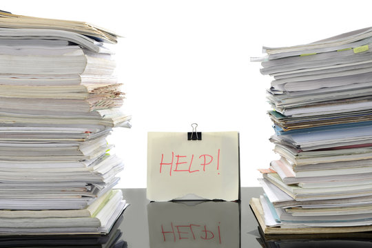 Stack of documents on working desk in office, for overload work and help needed