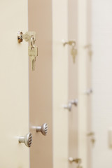 White umbrella on a closed doors in a cloak-room