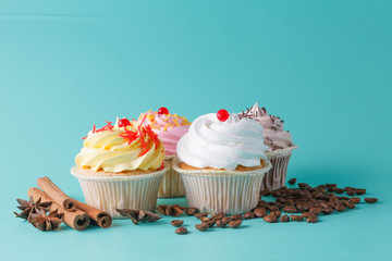 colorful pink cupcake on aquamarine background