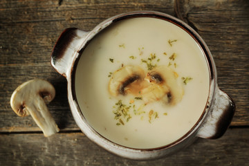 Mushroom soup on a rustic background
