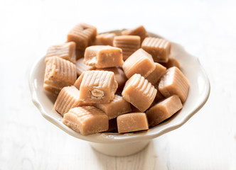 Sweet homemade caramel bonbons with almons,selective focus