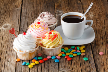 Colored cupcake on rustic background