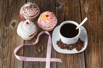 Colored cupcake on rustic background