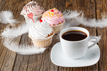 Colored cupcake on rustic background