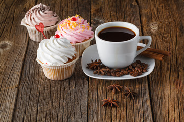 Colored cupcake on rustic background
