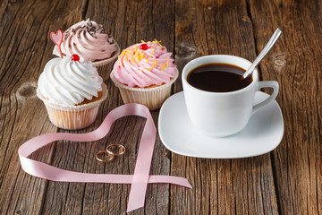 Colored cupcake on rustic background