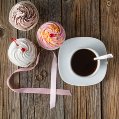 Colored cupcake on rustic background