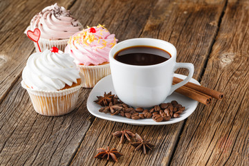 Colored cupcake on rustic background