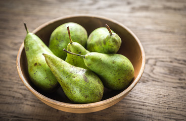 Fresh pears in the rustic bowl
