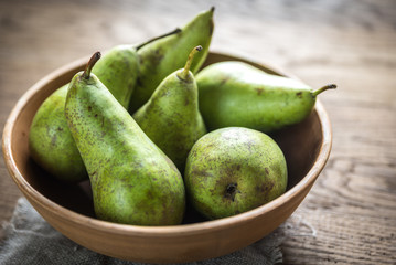 Fresh pears in the rustic bowl