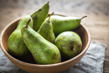 Fresh pears in the rustic bowl