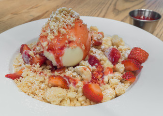 Vanilla ice cream with fresh strawberry  in selective focus