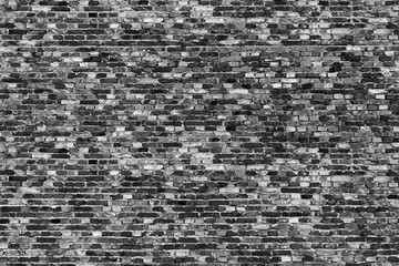 Background of  tiny bricks texture. Black and white photo.