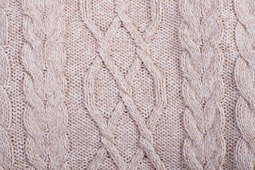 Clean beige knitted wool.