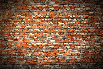 Background of red, tiny bricks texture. Vignette.
