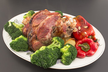 Baked pork knuckle with vegetables