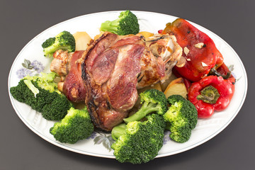 Baked pork knuckle with vegetables