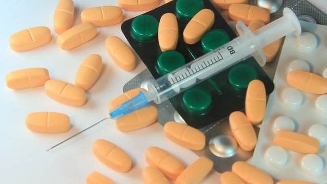 Medical syringe and pills