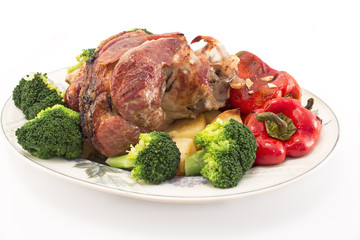 Baked pork knuckle with vegetables