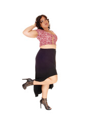 Young plus size woman standing.