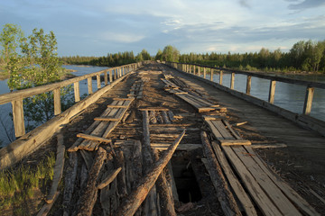 The old bridge on the river Indigirka. Kolyma road.