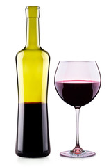 Elegant red wine glass and bottle isolated
