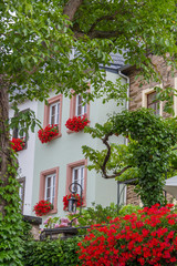 Traditional house with flower pots on its windows in Beilstein village on the river Mosel in Germany