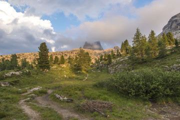 Mount Averau at sunset reflected in lake Limedes, blue sky with clouds, pass Falzarego, Dolomites, Veneto, Italy