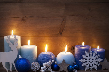 Obraz na płótnie Canvas Christmas Card With Blue Candles, Reindeer, Ball