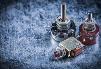 Electric toggles on metallic surface top view electricity concep