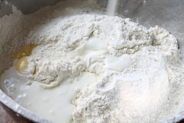 Still life. Flour with an eggs and milk in a bowl
