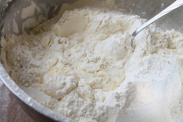 Still life. Flour with an eggs and milk in a bowl