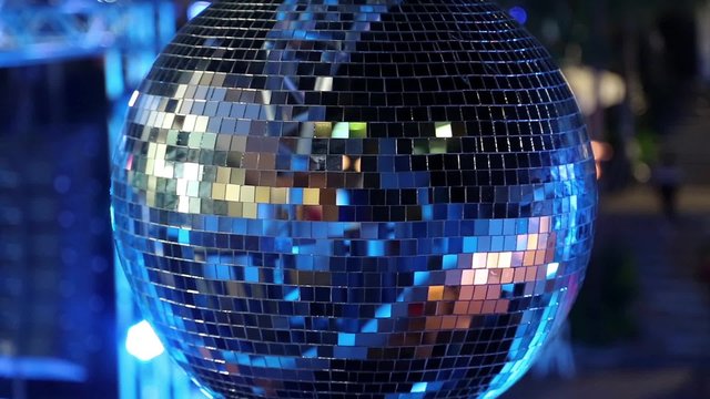 Spinning glitterball on dancefloor