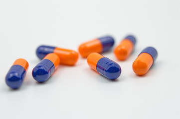 Blue and orange capsules