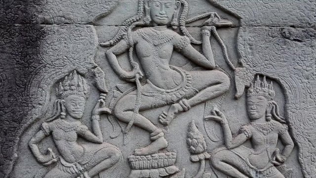 Bas-relief on the ancient wall in Angkor Thom temple complex, Cambodia