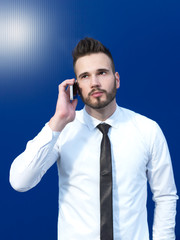 Businessman in front of blue background smiling