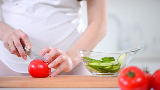 Healthy eating for pregnant woman. Cooking fresh vegetables salad