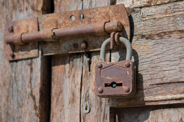 Old rusted padlock, reliable or unreliable, safety concept, made in Germany