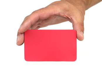 Hand holding and showing a red card and copy space.