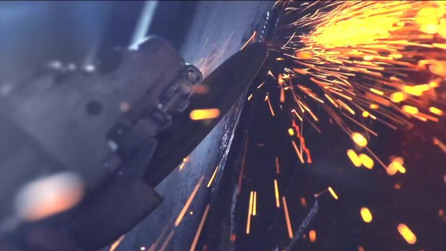 Metal sawing. Grinding process on steel structure